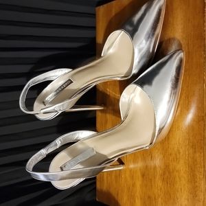 Beautiful silver metallic 5 inch stilleto heels! Never worn only stored.